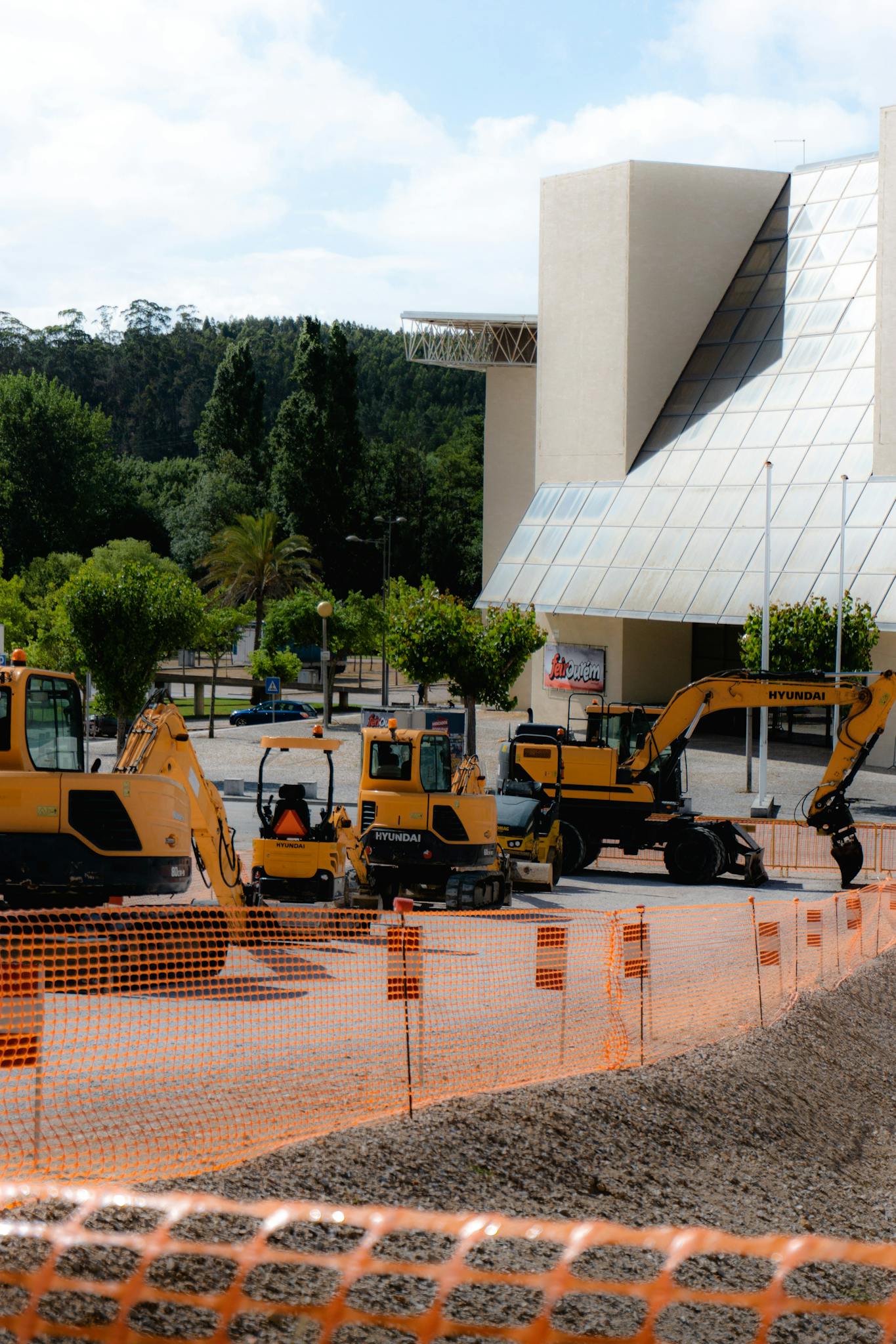 A busy construction site with bulldozers and heavy machinery in Portugal.